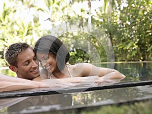 Happy Couple In Swimming Pool