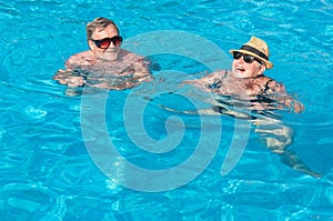 Happy couple in swimming pool