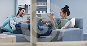 Happy couple, tablet and phone in relax on sofa for online streaming, entertainment or social media at home. Man and