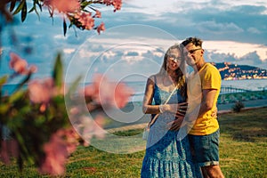 Happy couple taking a photo on a beach