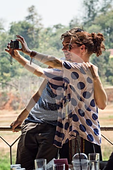 Happy couple taking a photo of themselves in Kanchanaburi, Thailand