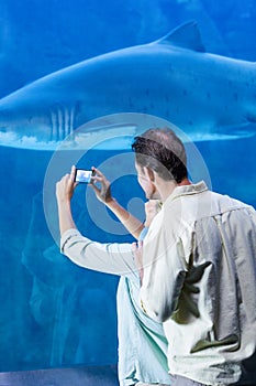 Happy couple taking a picture of a shark