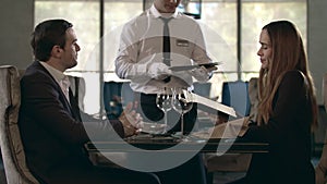 Happy couple talking at restaurant. table. Business couple reading menu in cafe