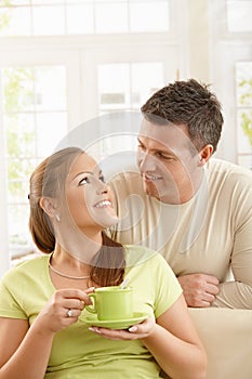 Happy couple with tea cup