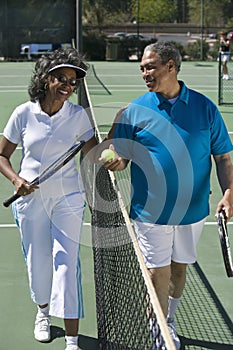 Happy Couple On The Tennis Court