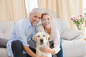 Happy couple with their pet dog