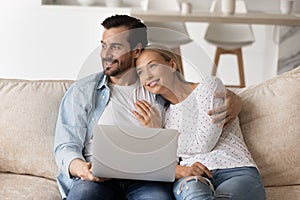 Happy couple thinking of family future, dreaming of home owning