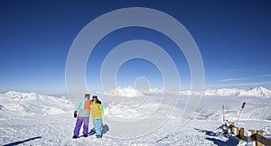 Happy couple at the top of the mountain