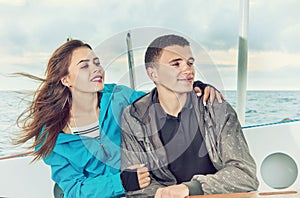 Happy couple, travel sailing on open sea
