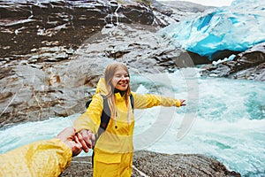 Happy Couple travelers holding hands traveling together