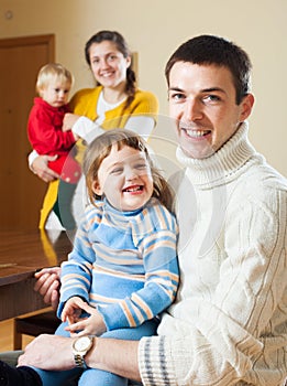 Happy couple with two children