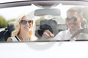Happy couple usin gps navigation system in car