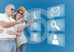 Happy couple using digital tablet