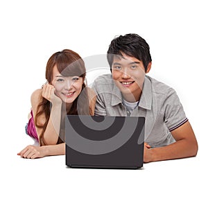 Happy couple using laptop