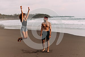 Happy couple on vacation. Lovers on the coast. Man and woman are resting on the sea. Beautiful couple have fun at the sea.