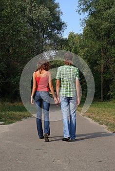 Happy couple walking in the park