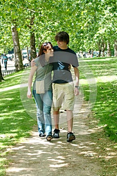 Happy couple walking in park