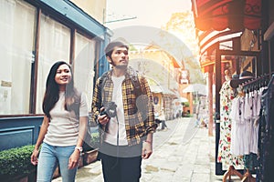 Happy couple walking in urban ,Young adults tourists on travel urban walking together.