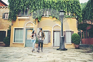 Happy couple walking in urban ,Young adults tourists on travel urban walking together. Couple travel