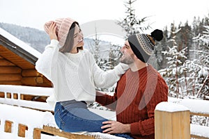 Happy couple in warm sweaters on winter day