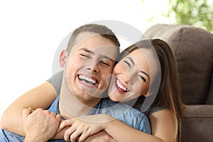 Happy couple with white smile at home photo