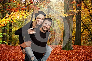 Happy couples in autumn forest photo