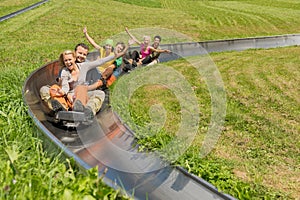 Happy Couples Enjoying Summer Sledge