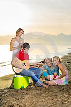 Happy Couples Enjoying their Drinks at the Beach
