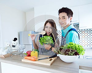 Happy couples in kitchen