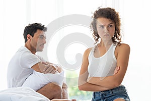 Happy couples relaxing in the white bedroom