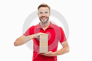 Happy courier holding cardboard box. Courier guy isolated on white. Courier service