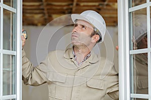 happy craftsman installing window