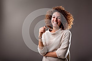 Happy curly south-american woman laughter