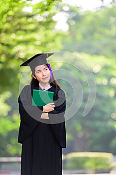 Happy cute asian students graduated holding diplomas