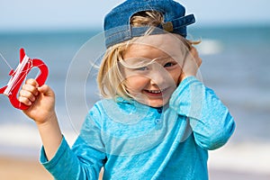 Happy cute boy flying kite