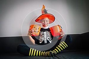 Happy cute boy prepare for halloween celebration