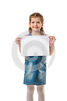 Happy cute child girl holding empty blank