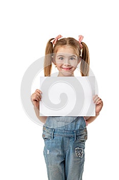 Happy cute child girl holding empty blank