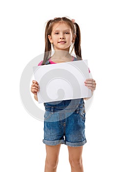 Happy cute child girl holding empty blank