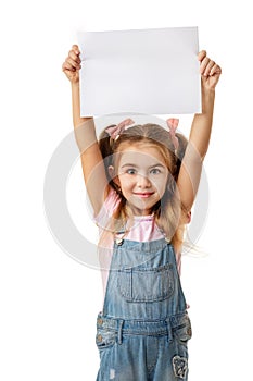 Happy cute child girl holding empty blank