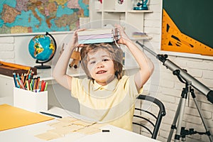 Happy cute clever boy with book. Educational process. Little ready to study. Little children at school lesson.