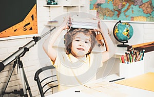 Happy cute clever boy with book. Educational process. Little ready to study. Little children at school lesson.