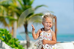 Happy cute girl have a fun on tropical beach