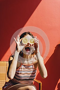 Happy cute girl with oranges