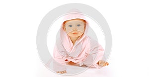 Happy cute little baby crawling in pink bathrobe on the floor on white background, banner blank copy space for advertising text