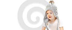 Happy cute little baby wearing gray knitted hat isolated on white background, banner blank copy space for advertising text