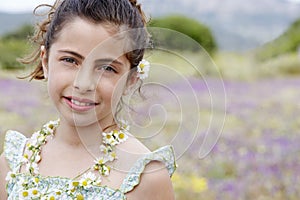 Happy Cute Little Girl In Flower Necklace