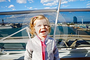 Happy cute little toddler girl on cruise ship. Adorable baby child making family vacations cruising through Europe and