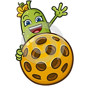 Happy cute pickle cartoon peeking out and waving from behind a super huge pickleball