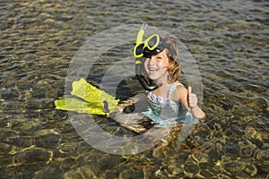 Happy cute snorkel girl on vacation